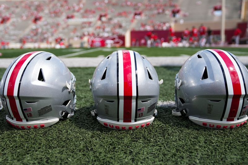 Sep 2, 2023; Bloomington, Indiana, USA; Ohio State Buckeyes helmets sit on the sideline prior to the NCAA football game at Indiana University Memorial Stadium.