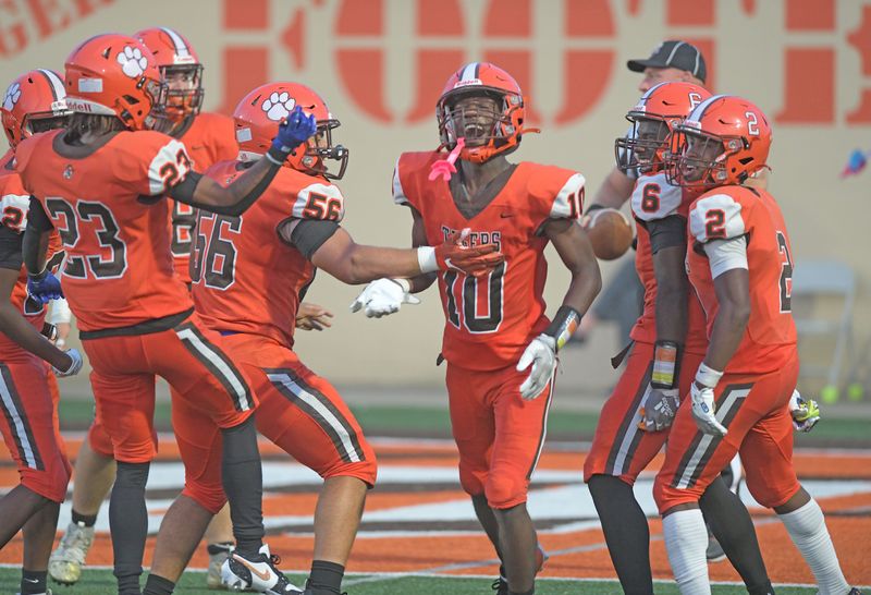 Terrance Feagin celebrates an 85 yard touchdown reception with his Tyger teammates Friday night at Arlin Field.