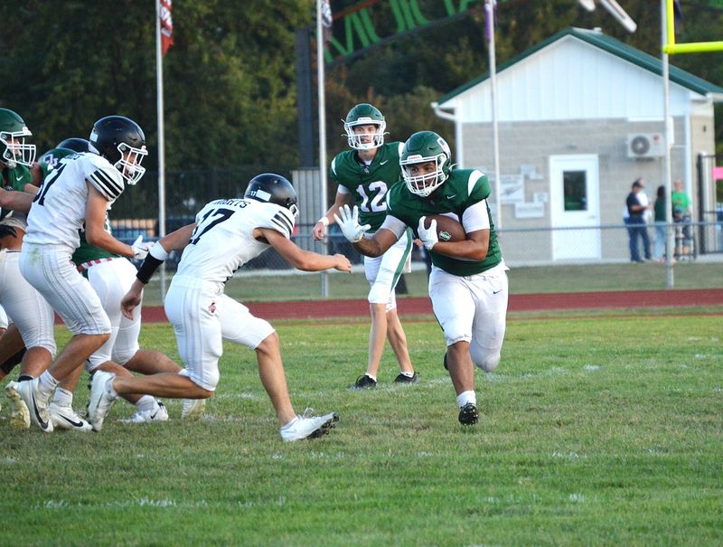 Oak Harbor's Travis Bouyer carries the ball.