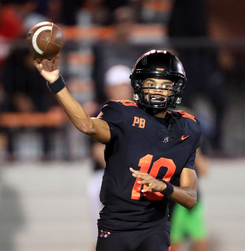 Massillon quarterback Manny Patterson throws to a receiver during action Friday night, September 19, 2025 at Paul Brown Tiger Stadium. Ed Hall Jr. / Special To The Repository