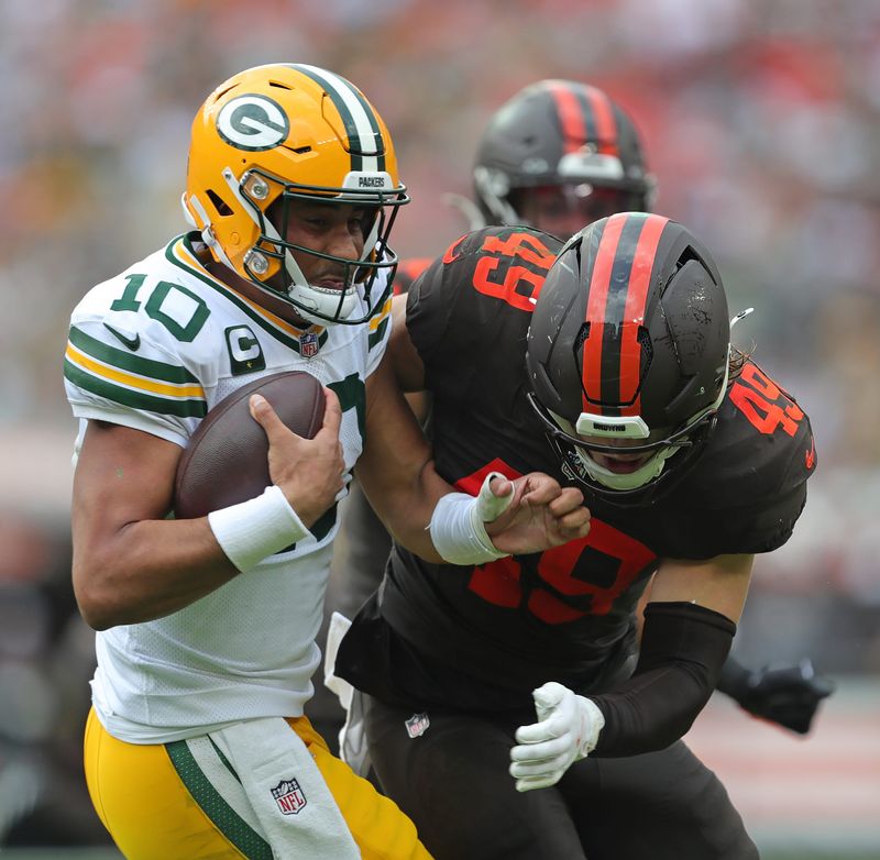 Cleveland Browns linebacker Carson Schwesinger (49) sacks Green Bay Packers quarterback Jordan Love (10) during the second half of an NFL football game at Huntington Bank Field, Sept. 21, 2025, in Cleveland, Ohio.