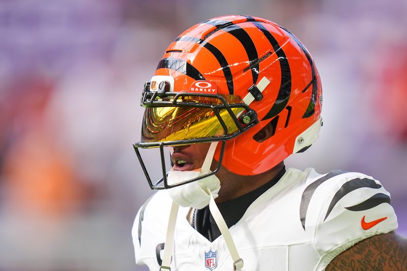 Sep 21, 2025; Minneapolis, Minnesota, USA; Cincinnati Bengals wide receiver Ja'Marr Chase (1) warms up prior to a game against the Minnesota Vikings at U.S. Bank Stadium. Mandatory Credit: Brad Rempel-Imagn Images