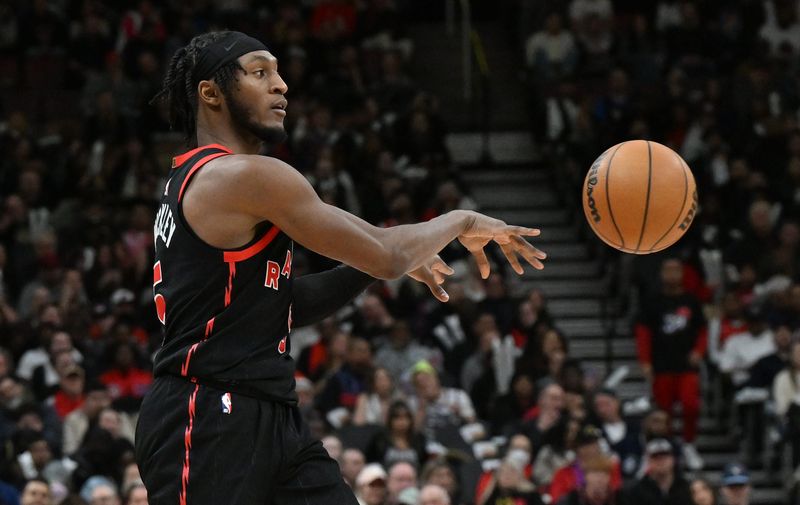 Apr 4, 2025; Toronto, Ontario, CAN; Toronto Raptors guard Immanuel Quickley (5) passes the ball against the Detroit Pistons in the second half at Scotiabank Arena. Mandatory Credit: Dan Hamilton-Imagn Images