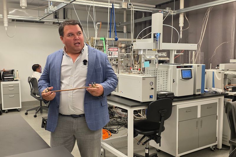 Tom Darrah, chief technology officer for Kaloma, in one of the company's laboratories at the OSU Energy Advancement and Innovation Center explaining how the company tests rocks for potential sources of hydrogen