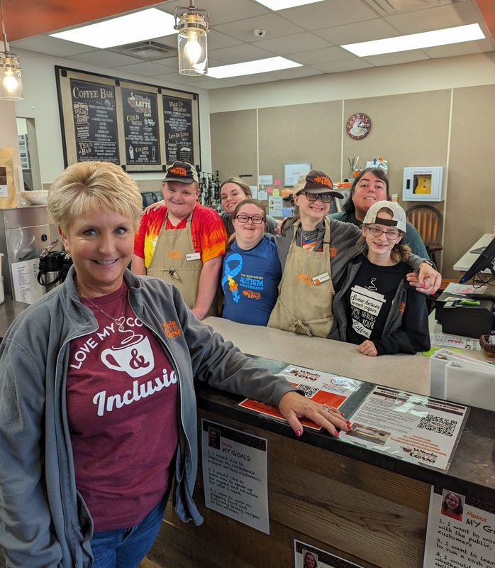 Beth Humbert, founder of the Whole Latte Love Cafe, has launched the Whole Community Academy to foster job readiness for people with developmental disabilties. With her are (l-r) Griffin Hawker, Sidney Carroll, Emma Stone, Caroline Humbert, Arianna Cain and Hanna Smith