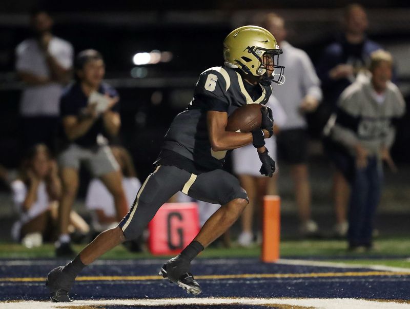 Hoban defensive back Jaiden Daniels turns up the field with a second-half interception near his own goal line against Walsh Jesuit, Sept. 26, 2025.