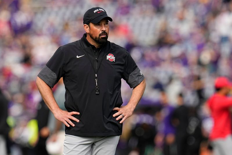 Ohio State Buckeyes head coach Ryan Day watches warm ups prior to the NCAA football game against the Washington Huskies at Husky Stadium in Seattle on Sept. 27, 2025.