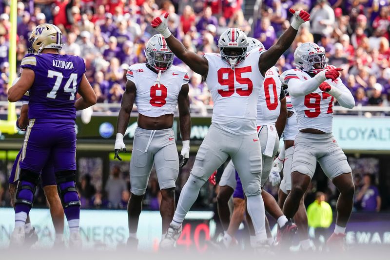 Ohio State Buckeyes defensive tackle Tywone Malone Jr. (95) celebrates during the first half of the NCAA football game against the Washington Huskies at Husky Stadium in Seattle on Sept. 27, 2025.
