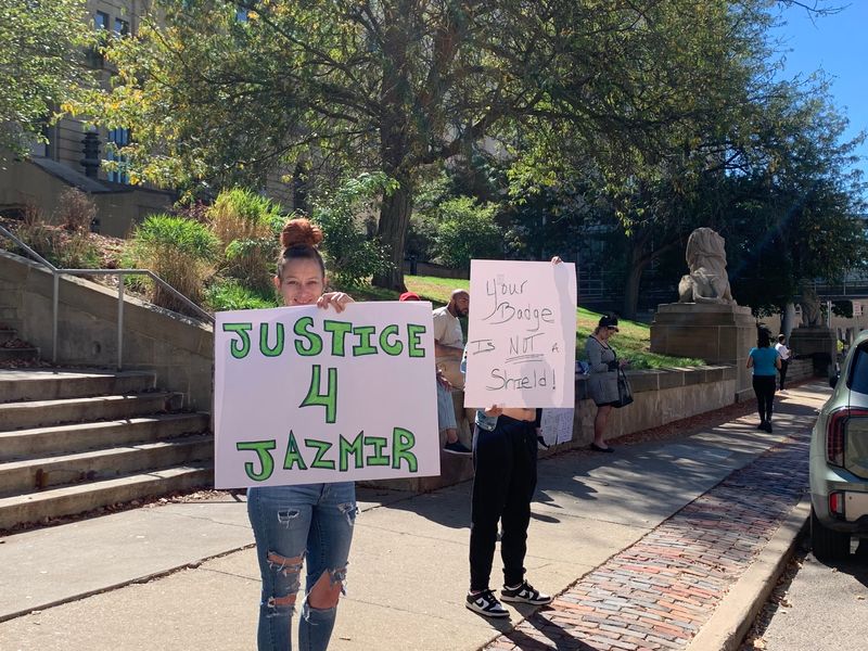 Akron residents, including Monica Moening, left, demonstrate outside the Summit County Courthouse on Oct. 1, 2025, two days after they say grand jurors first met to hear evidence in the police killing of Jazmir Tucker.