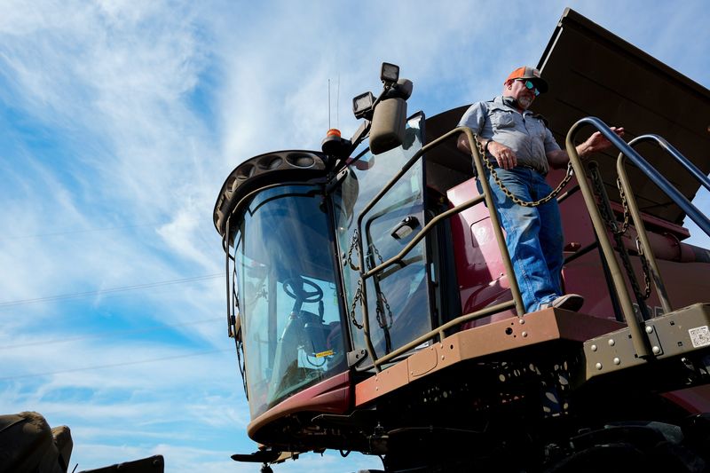 Scott Metzger walks out of his CASE IH Combine in a field off of State Route 138 on Thursday, Oct. 2, 2025 in Clarksburg, Ohio.