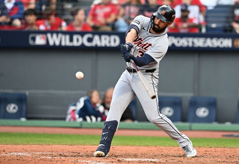 Oct 2, 2025; Cleveland, Ohio, USA; Detroit Tigers outfielder Riley Greene (31) hits a RBI single in the seventh inning against the Cleveland Guardians during game three of the Wildcard round for the 2025 MLB playoffs at Progressive Field. Mandatory Credit: Ken Blaze-Imagn Images