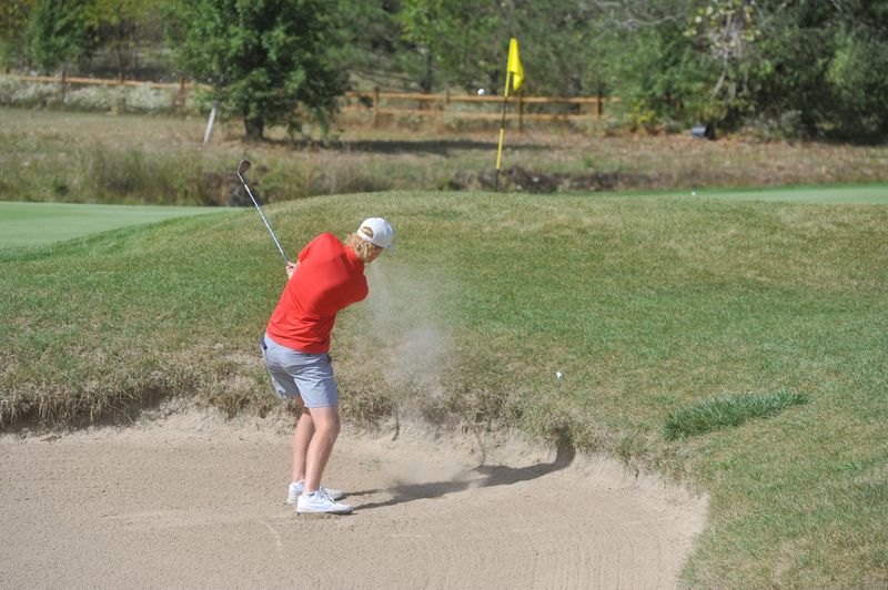 Crestview's Carter Bowman hits out of the sand on No. 18 at Stone Ridge in the Division III district tournament.