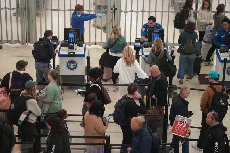 TSA agents screen and direct passengers at John Glenn International Airport in Columbus, Ohio October 3, 2025.