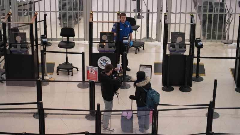 Jan 9, 2024; Columbus, OH, USA; A TSA agent at the John Glenn International Airport prepare to scan documents for travelers Jan 9, 2024.