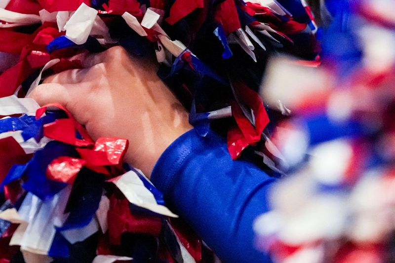 Hamilton Southeastern cheerleaders hold their pom poms Friday, Dec. 27, 2024, during the Girls Basketball Hall of Fame Classic at New Castle Fieldhouse.