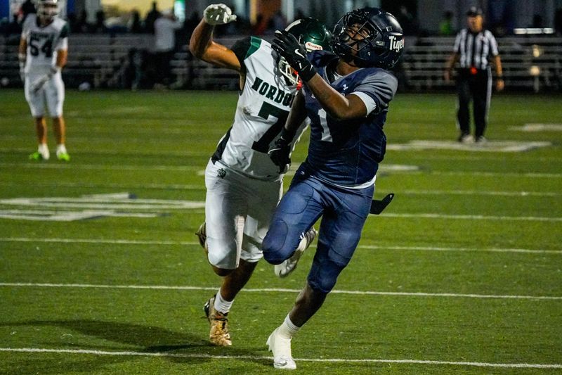 Twinsburg’s RJ Ruffin (1) and Nordonia’s Dominick Jackson (7) vie for a pass that fell incomplete, Oct. 3, 2025, in Twinsburg, Ohio.