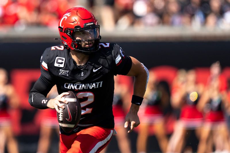 Cincinnati Bearcats quarterback Brendan Sorsby (2) rolls out of the pocket in the first quarter of the NCAA football game between the Cincinnati Bearcats and Iowa State Cyclones at Nippert Stadium in Cincinnati on Oct. 4, 2025.
