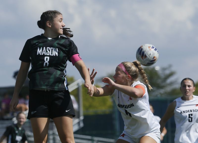 Mason senior Anna Habra (8) and Anderson senior Leah Fiktus (6) battle for the ball as Mason defeated Anderson 3-2 in girls soccer Oct. 4, 2025, at Mason's campus