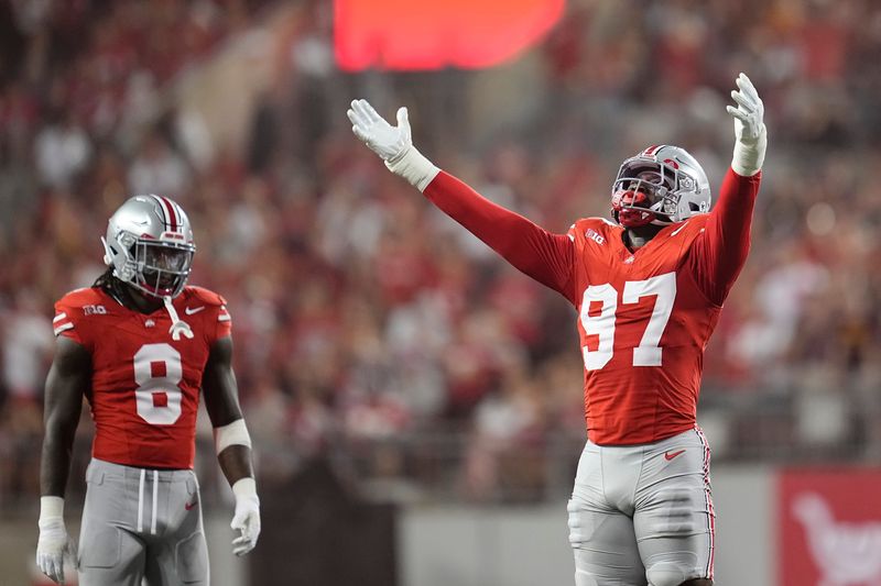 Ohio State Buckeyes defensive end Kenyatta Jackson Jr. (97) celebrates a timeout taken by Minnesota Golden Gophers on the first offensive play of the game during the first half of the NCAA football game at Ohio Stadium in Columbus on Oct. 4, 2025.