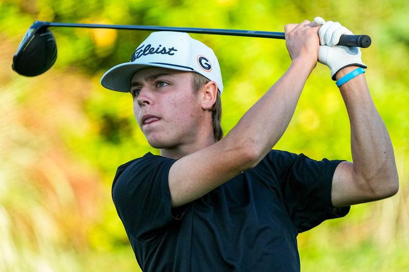 Green’s Silas Kirkpatrick tees off during an OHSAA D1 Boys District Golf match, Oct. 6, 2025, at Pine Hills Golf Club in Hinckley, Ohio.
