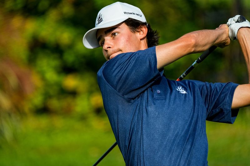Hudson’s Ben Fauver tees off during an OHSAA D1 Boys District Golf match, Oct. 6, 2025, at Pine Hills Golf Club in Hinckley, Ohio.