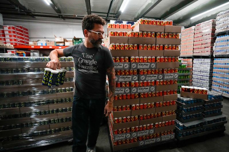 Colin Vent, Brew Master, grabs a pack of the Wild Blueberry THC Soda at Seventh Son Brewing Co. on Wednesday, Oct. 8, 2025 in Columbus, Ohio.