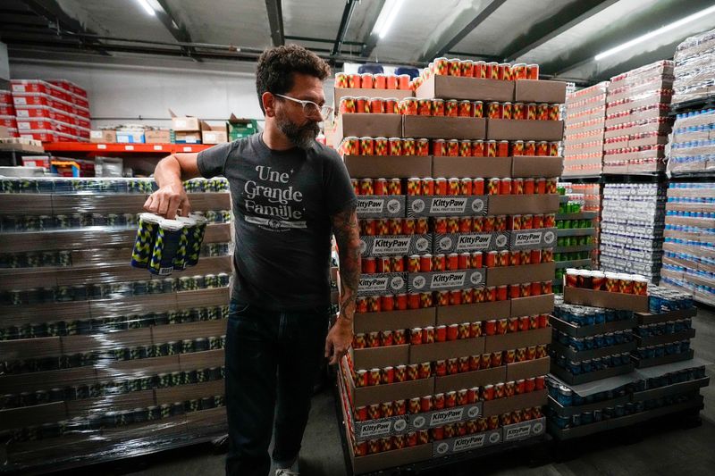 Brewmaster Colin Vent grabs a pack of Green Buddy THC soda at Seventh Son Brewing in August 2025.
