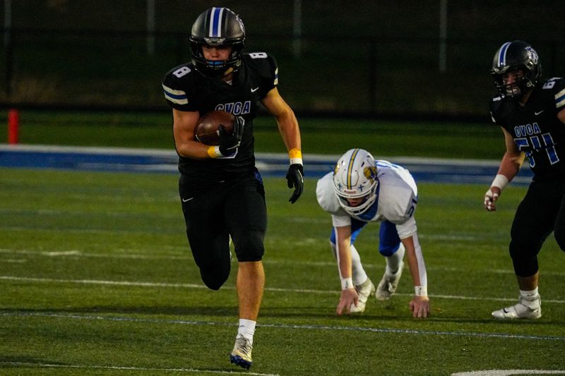 CVCA’s Zac Anderson (8) picks up yardage on a run against NDCL, Oct. 10, 2025, in Cuyahoga Falls, Ohio.
