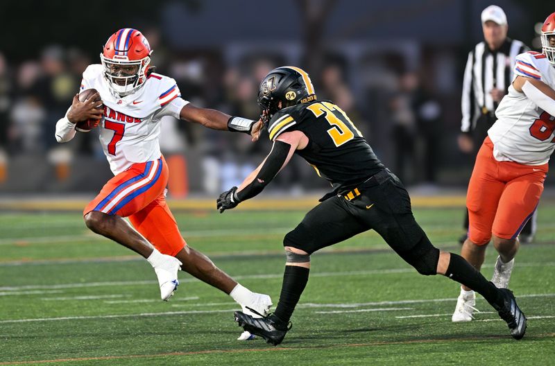 Olentangy Orange's Levi Davis tries to fend off Upper Arlington's Andrew Petzinger on Oct. 10. Davis was named Division I district co-Offensive Player of the Year. Petzinger was named first-team all-district on defense.