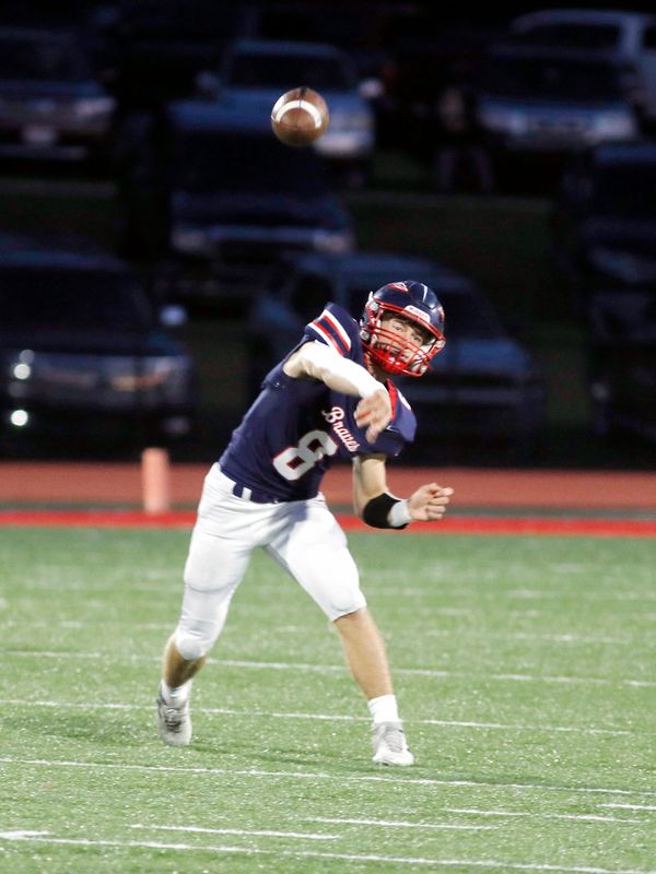 Indian Valley junior quarterback Ryker Williams throws a pass during the first quarter of a 42-14 win against visiting Ridgewood on Friday, Oct. 10, 2025, in Gnadenhutten, Ohio. Williams was 5-of-7 passing for 88 yards and ran for 64 with a pair of touchdowns as the Braves improved to 7-0.