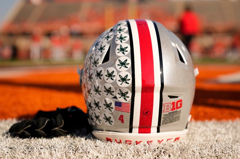 Ohio State Buckeyes wide receiver Jeremiah Smith's helmet sits on the sideline as the team warms up prior to the NCAA football game against the Illinois Fighting Illini at Gies Memorial Stadium in Champaign on Oct. 11, 2025.