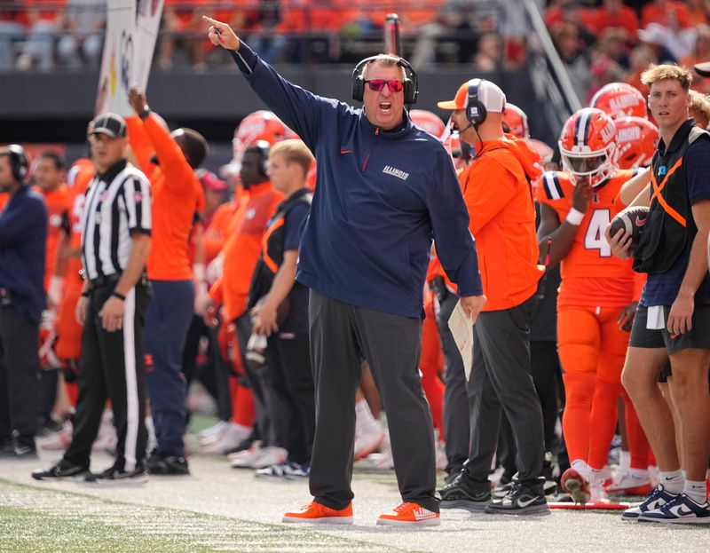 Illinois Fighting Illini head coach Bret Bielema motions during the first half of the NCAA football game against the Ohio State Buckeyes at Gies Memorial Stadium in Champaign on Oct. 11, 2025.