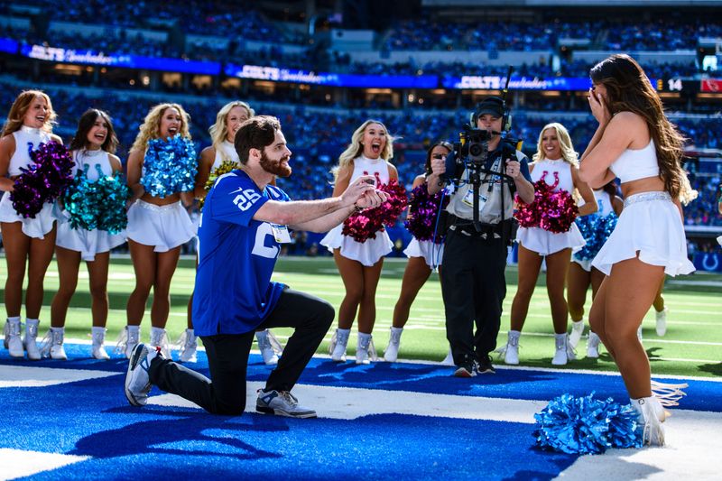 Indianapolis Colts cheerleader Mika Takahashi, a Hudson native, is in shock as her boyfriend Spencer Phillips proposes to her during an Oct. 12 game.