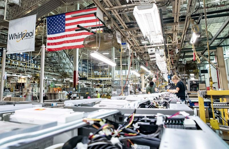Whirlpool Corporation employees work on an assembly line at the Clyde Division plant.