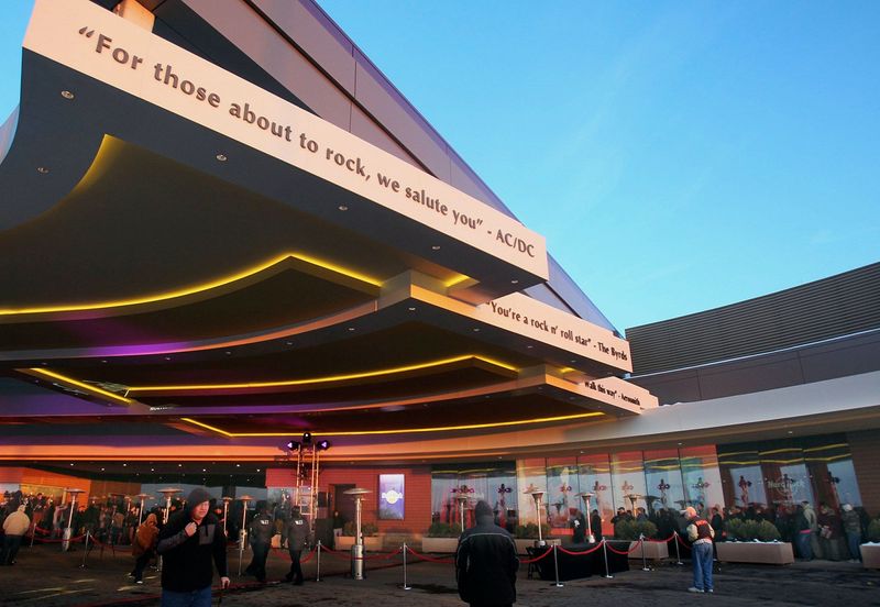 Song lyrics grace the overhang as people line up for the grand opening of the Hard Rock Rocksino Northfield Park in Northfield. (Mike Cardew/Akron Beacon Journal)
