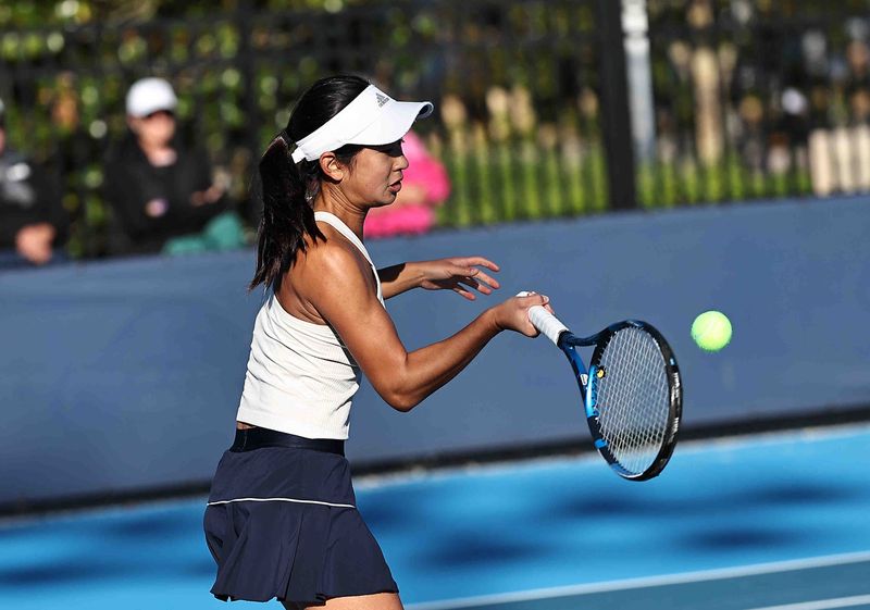 Hudson's Emma Liu returns the ball during the girls Division I OHSAA tennis tournament at Lindner Tennis Center Thursday, Oct. 16, 2025.