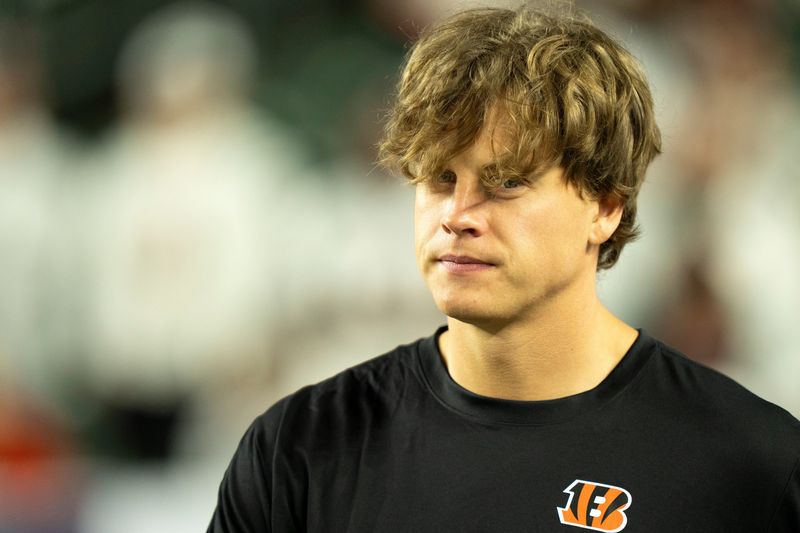 Cincinnati Bengals quarterback Joe Burrow (9) walks onto the field