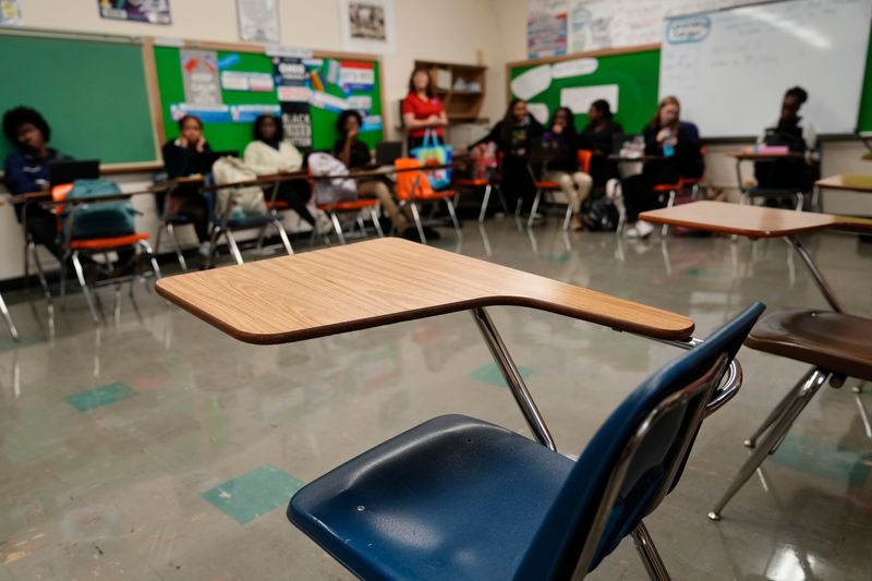 An empty classroom chair sits inside a government class at Eastmoor Academy on Oct. 15, 2025.