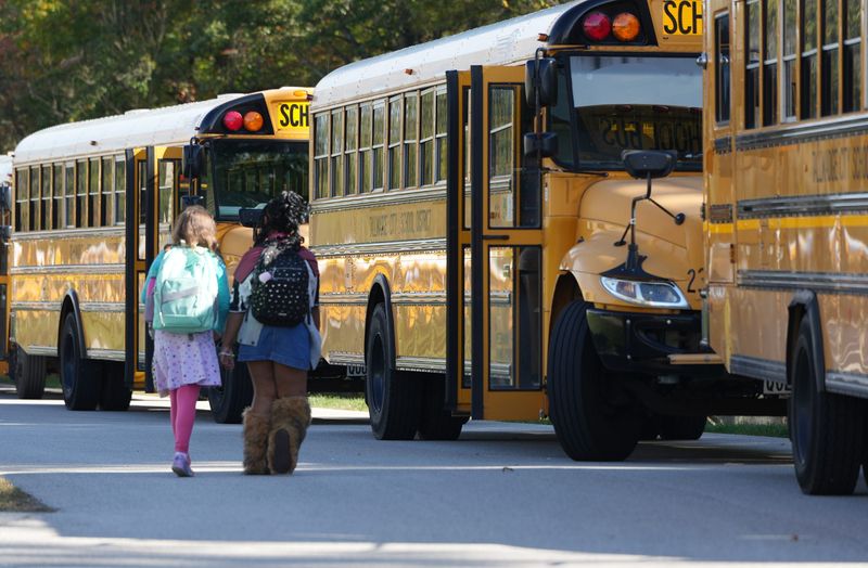Two students walk to their bus after school dismissal at Tallmadge Middle School on Oct. 17, 2025.