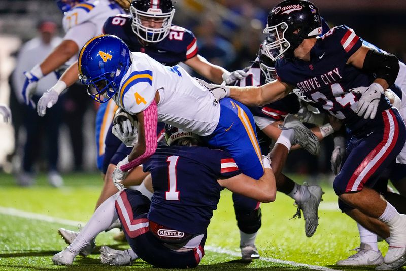 Grove City Greyhounds defensive back Trace Price (1) tackles Gahanna Lincoln Lions running back Gabriel Komrabai-Kanu (4) during the first half of the OHSAA high school football game at Grove City on Oct. 17, 2025.