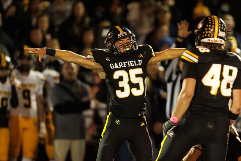 Garfield running back Ryder Cain celebrates during the first half of the game against Crestview High School Friday, October 17, 2025 in Garrettsville, OH.