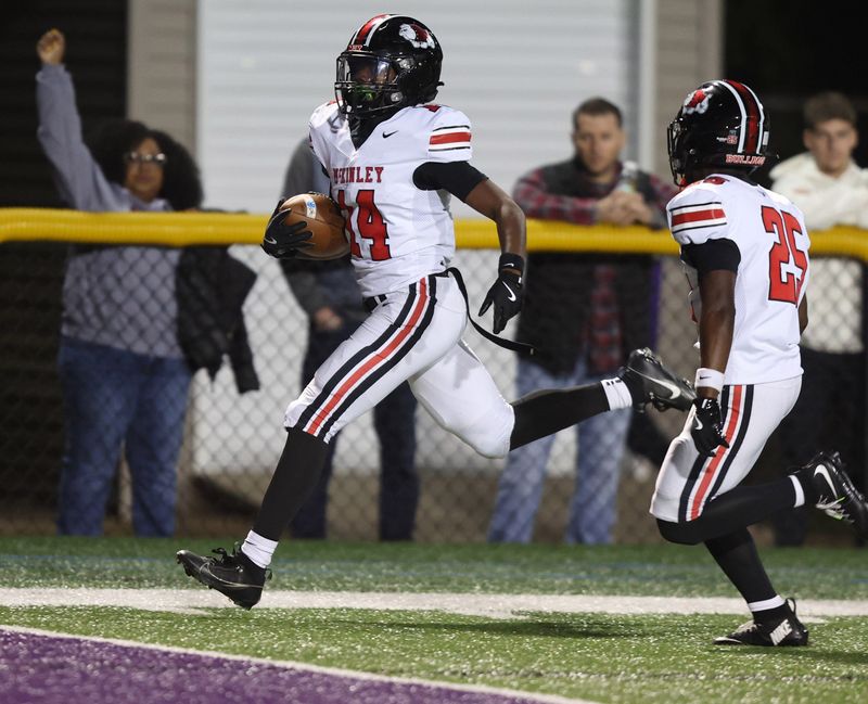 McKinley's Kyelin West runs for a 35-yard touchdown as teammate Derrick Gordon III guards for him in the first half against Jackson in this Federal League matchup at Jackson Friday, October. 17, 2025.