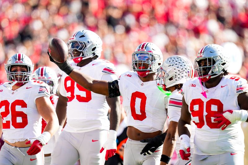 Ohio State Buckeyes linebacker Sonny Styles (0) celebrates after intercepting a pass in the first half at Camp Randall Stadium on Saturday, Oct. 18, 2025 in Madison, Wisconsin.