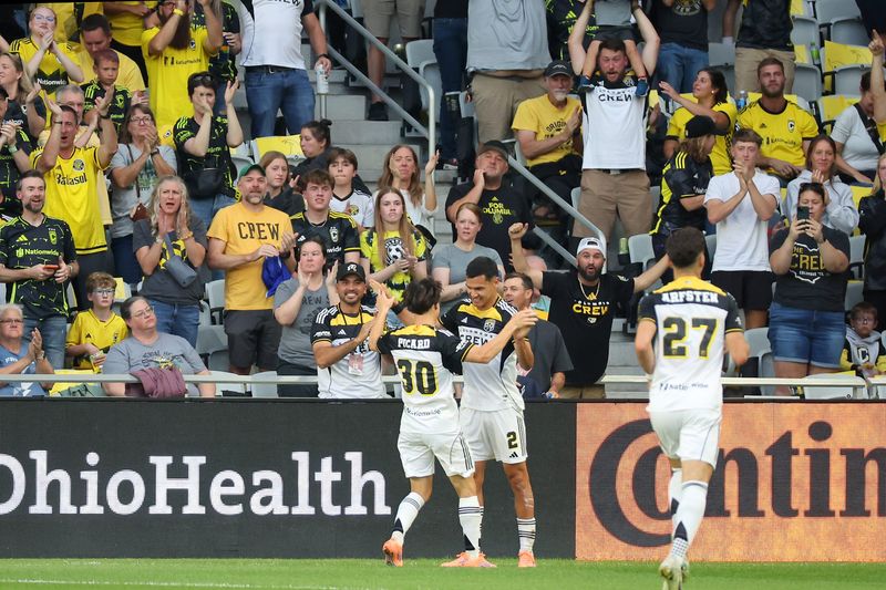 Oct 18, 2025; Columbus, Ohio, USA; Columbus Crew defender Marcelo Herrera (2) celebrates his goal with midfielder Hugo Picard (30) during the first half against the New York Red Bulls at Lower.com Field. Mandatory Credit: Joseph Maiorana-Imagn Images