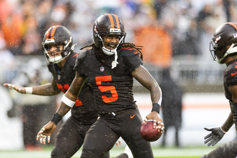 Oct 19, 2025; Cleveland, Ohio, USA; Cleveland Browns safeties Rayshawn Jenkins (5) reacts after recovering a turnover against the Miami Dolphins during the second quarter at Huntington Bank Field. Mandatory Credit: Scott Galvin-Imagn Images
