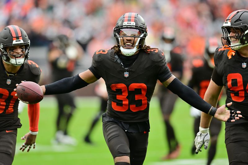 Oct 19, 2025; Cleveland, Ohio, USA; Cleveland Browns safety Ronnie Hickman Jr. (33) celebrates after intercepting a pass during the second half against the Miami Dolphins at Huntington Bank Field. Mandatory Credit: Ken Blaze-Imagn Images