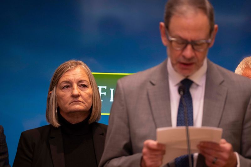 Former Cincinnati Police Chief Teresa Theetge looks on as her lawyer Steve Imm speaks to the press on her behalf for on Oct. 21, 2025 in Cincinnati.