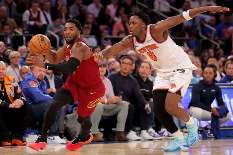 Cleveland Cavaliers guard Donovan Mitchell (45) brings the ball up court against New York Knicks forward OG Anunoby (8) on Oct. 22, 2025, in New York, New York.