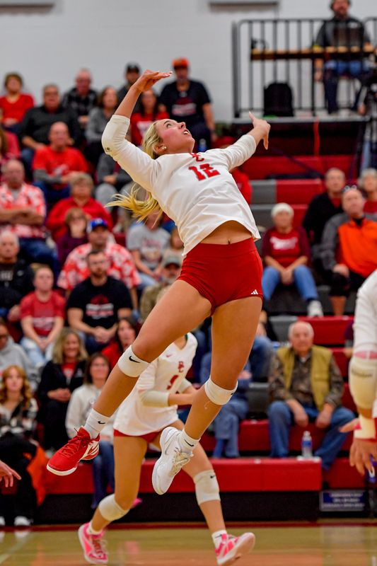 Buckeye Central's AJ Jury leaps up to swing at a ball for an attack.