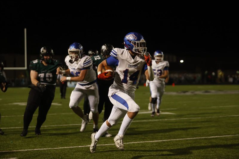 Bret Gray (14) explodes up the sideline for Clinton-Massie as they look to put the game against Batavia away Friday, Oct. 24, 2025, at Batavia High School.